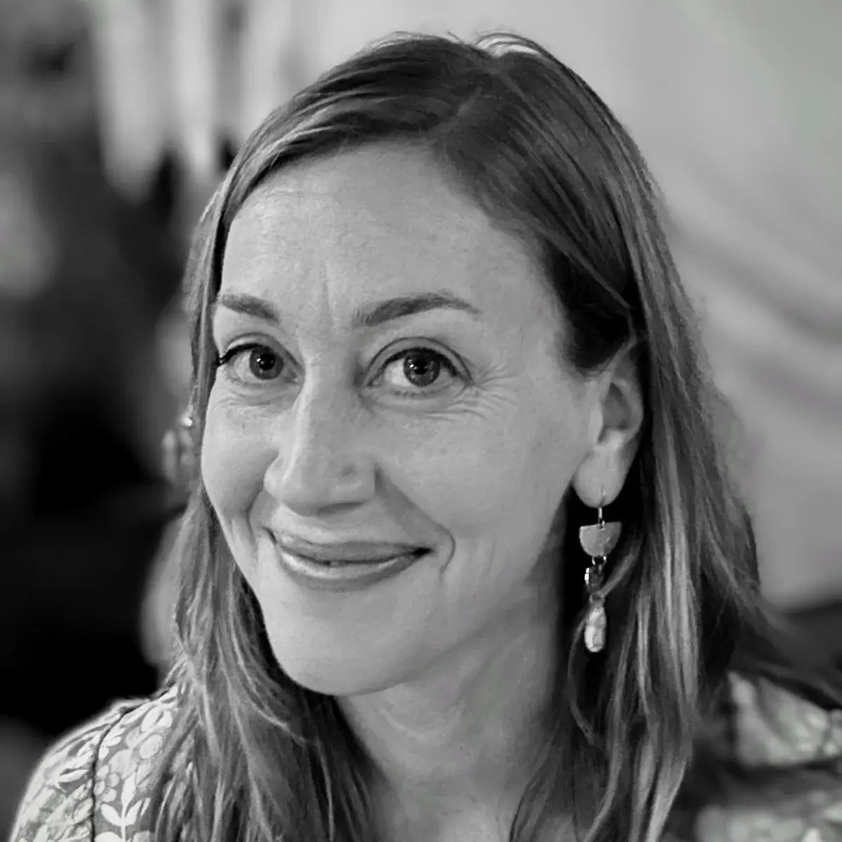 Artist headshot of Katherine Moore, Madison watercolorist and poet behind Lost Feather Studio.