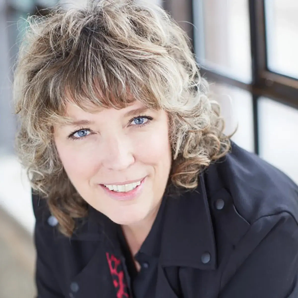 Artist headshot of Tonya Cameron, Wisconsin-based painter of rock and roll icons.